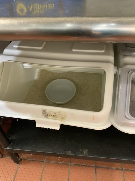 Rice bulk bin with bowl as scoop, no lid on top